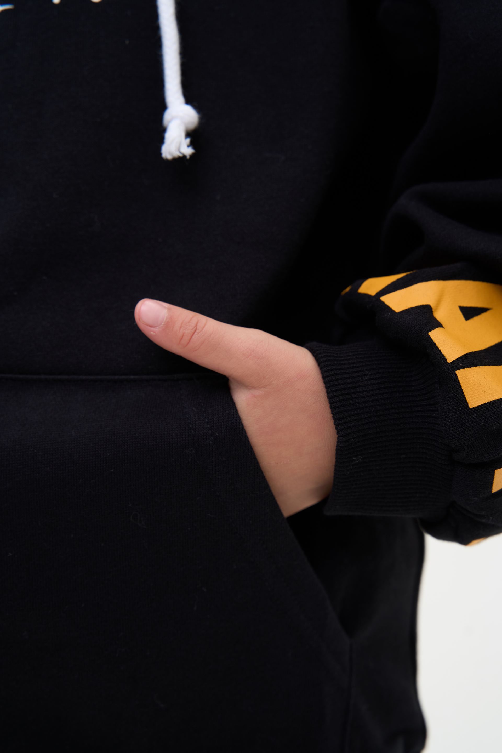 Black hoodie with orange lettering