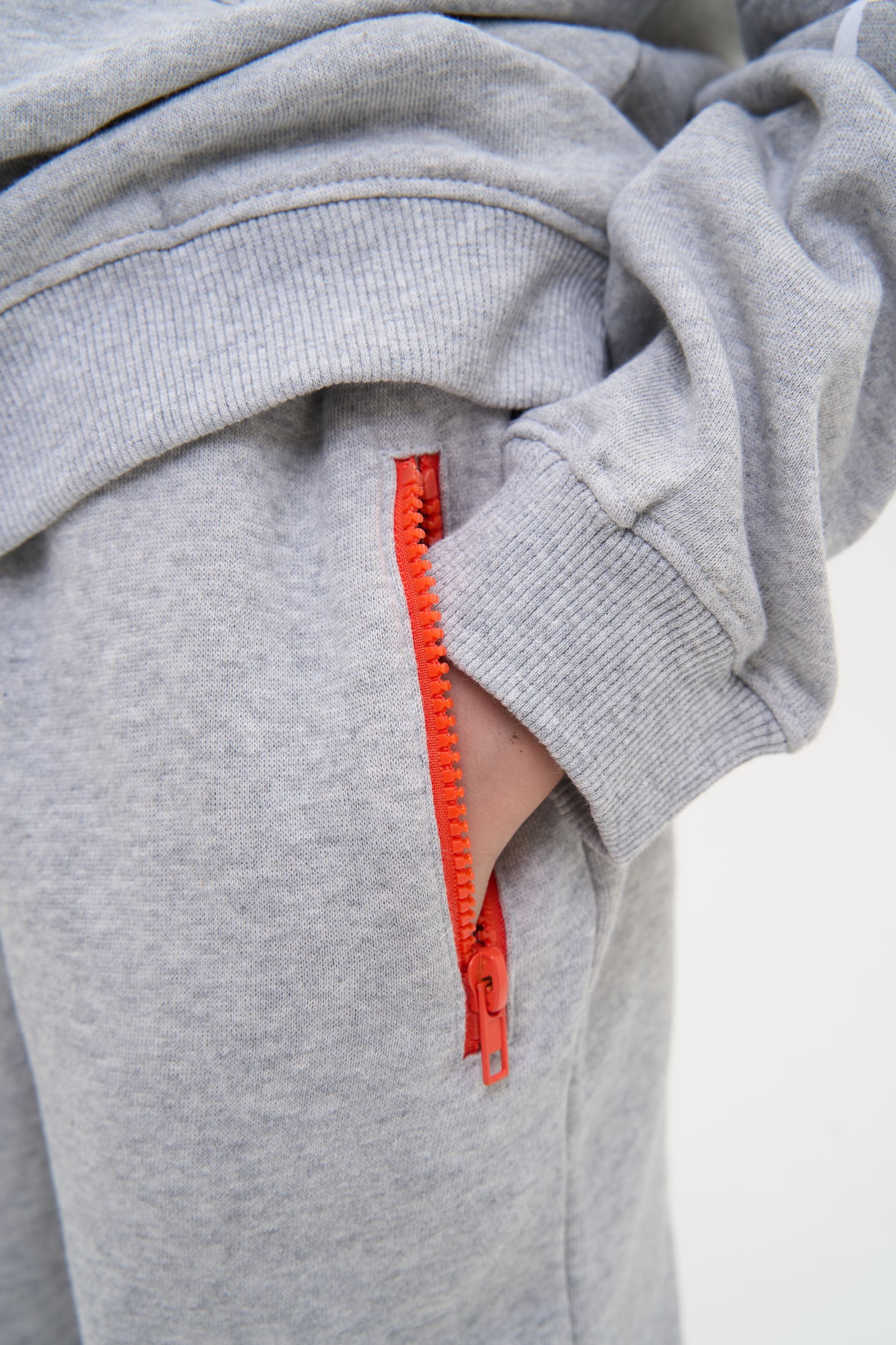 Sports trousers are gray with black inserts on the knees