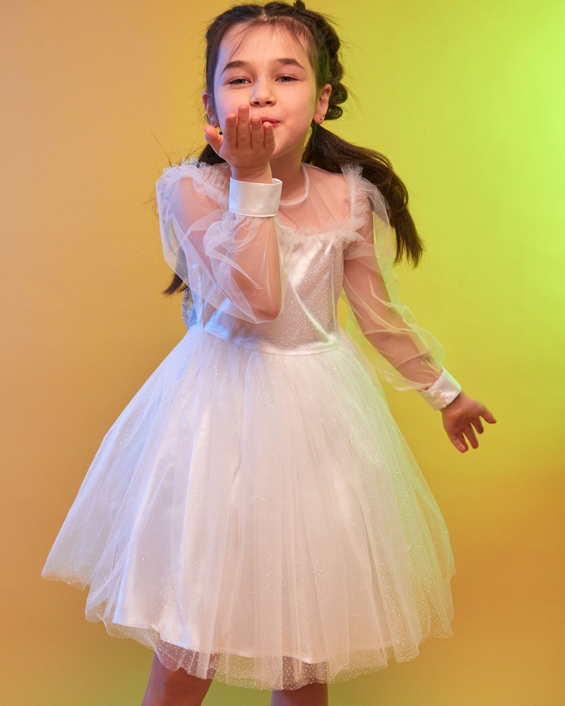 Elegant dress with a full skirt and a sequin bow White