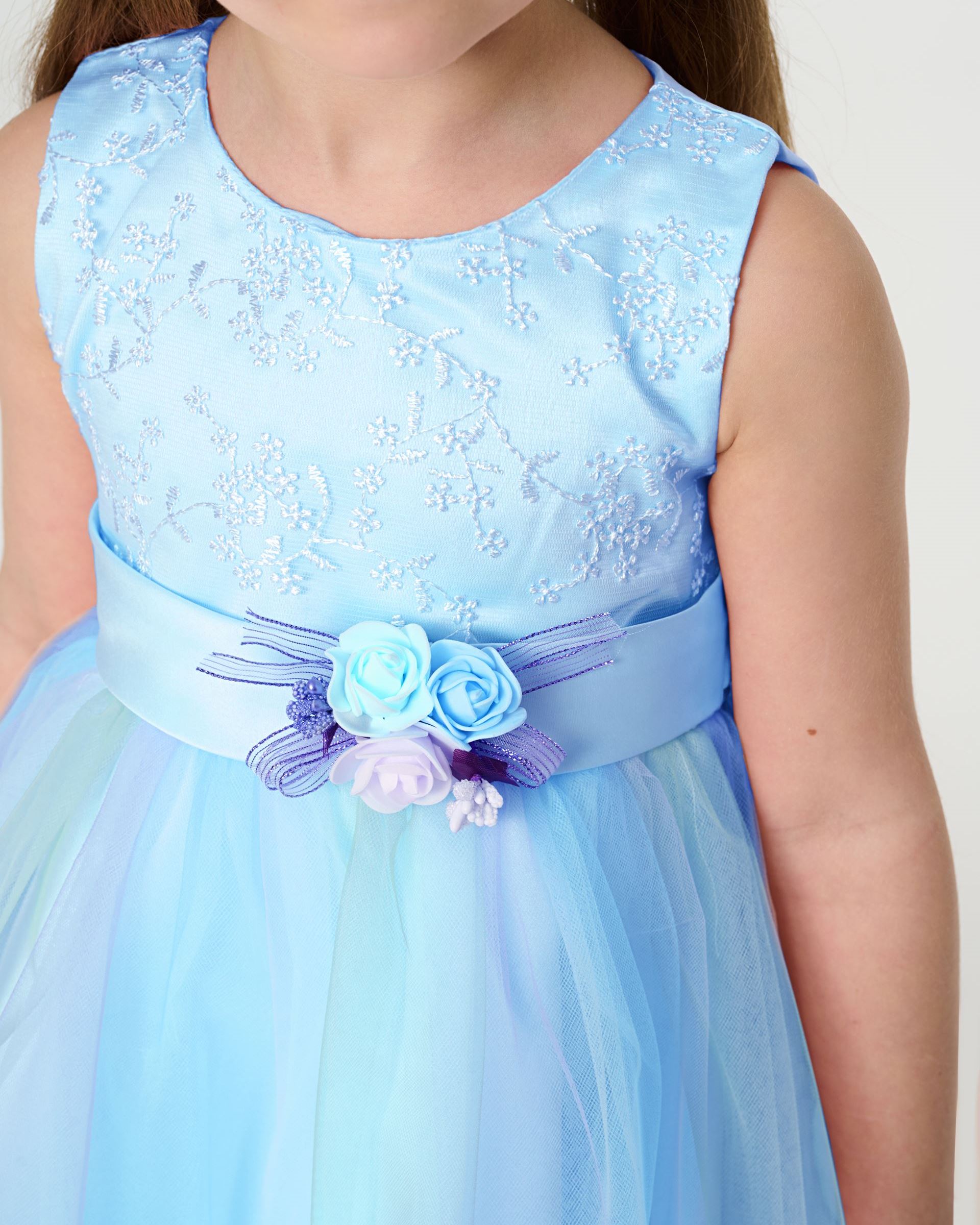 Blue elegant dress with roses on the belt and a gradient